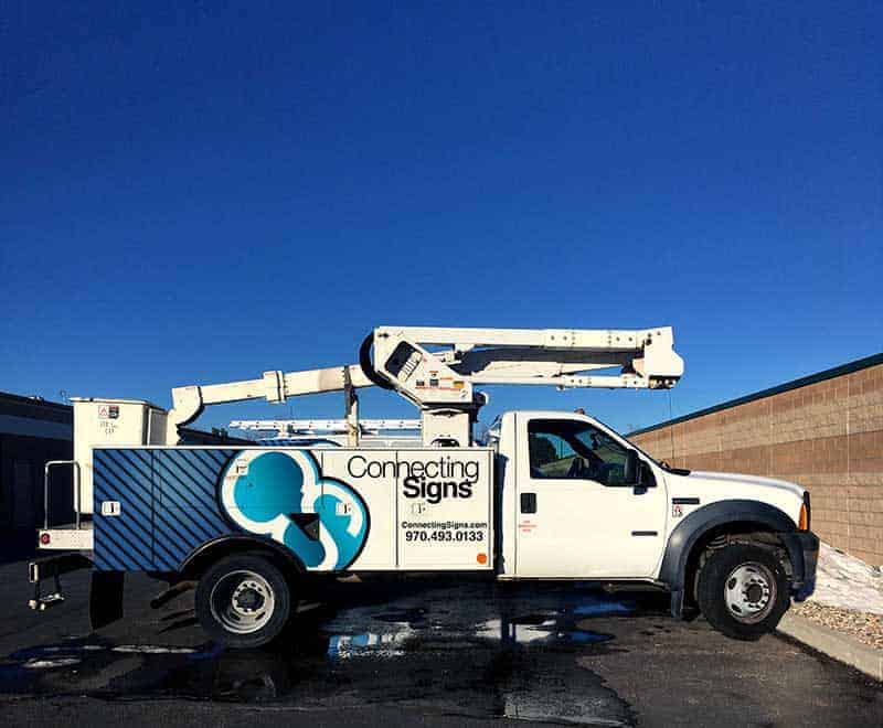 connecting signs bucket truck service