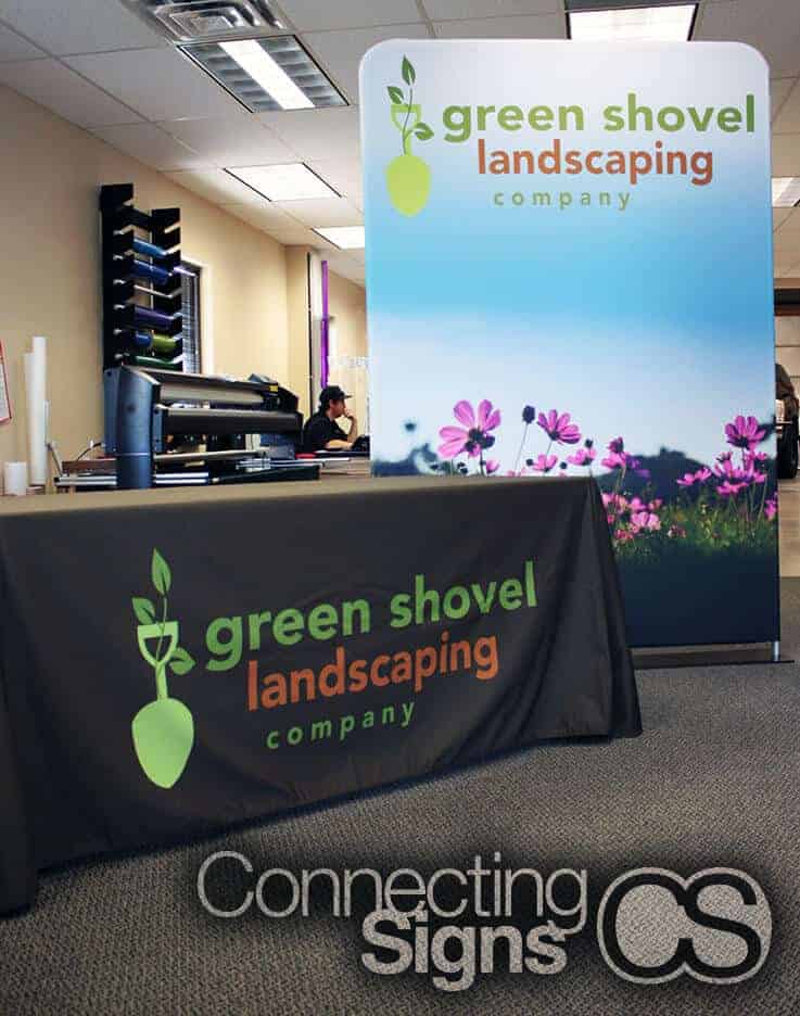 Green shovel landscaping company banner