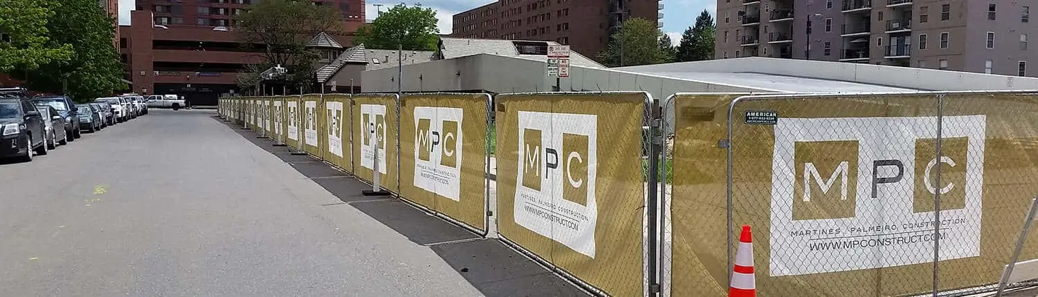 Mesh fence banner and site signs in Denver 