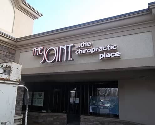 The Joint chiropractic place outside sign