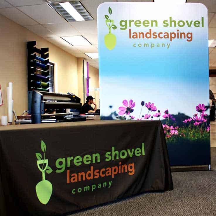 green shovel landscaping trade show signage examples